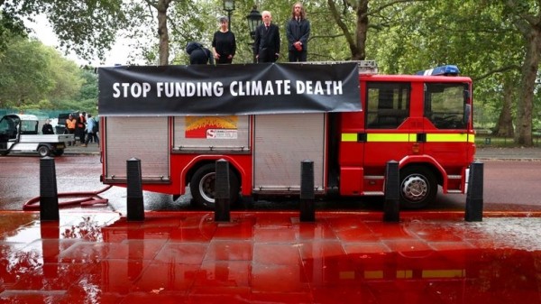 Extinction Rebellion protesters use fire engine to spray Treasury with fake blood
Extinction Rebellion protesters use fire engine to spray Treasury with fake blood