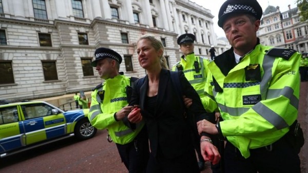 Extinction Rebellion protesters use fire engine to spray Treasury with fake blood
Extinction Rebellion protesters use fire engine to spray Treasury with fake blood